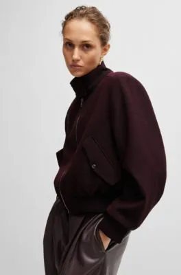 Chaqueta relaxed fit en sarga jaspeada con cremallera