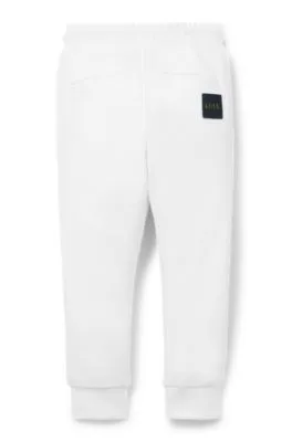 Pantalones de chándal para niños con puños en los bajos y logo en la parte trasera